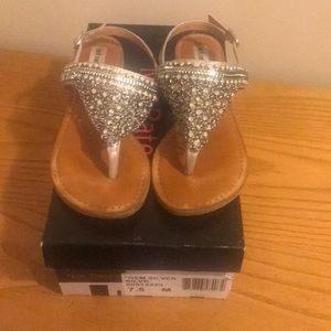 Women’s silver sandals.